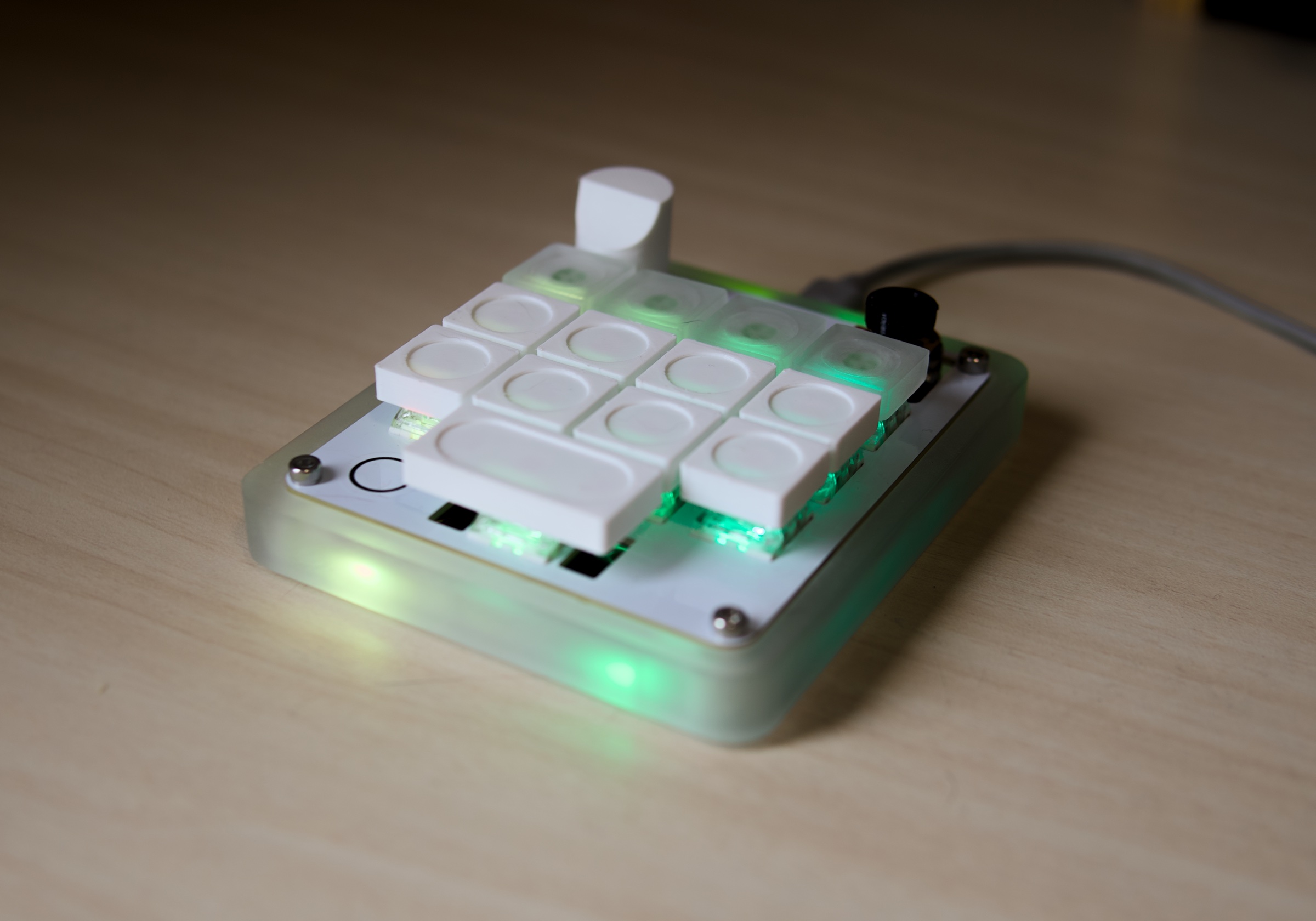 AgentPad13 powered on in its frosted case, with green edge lighting.