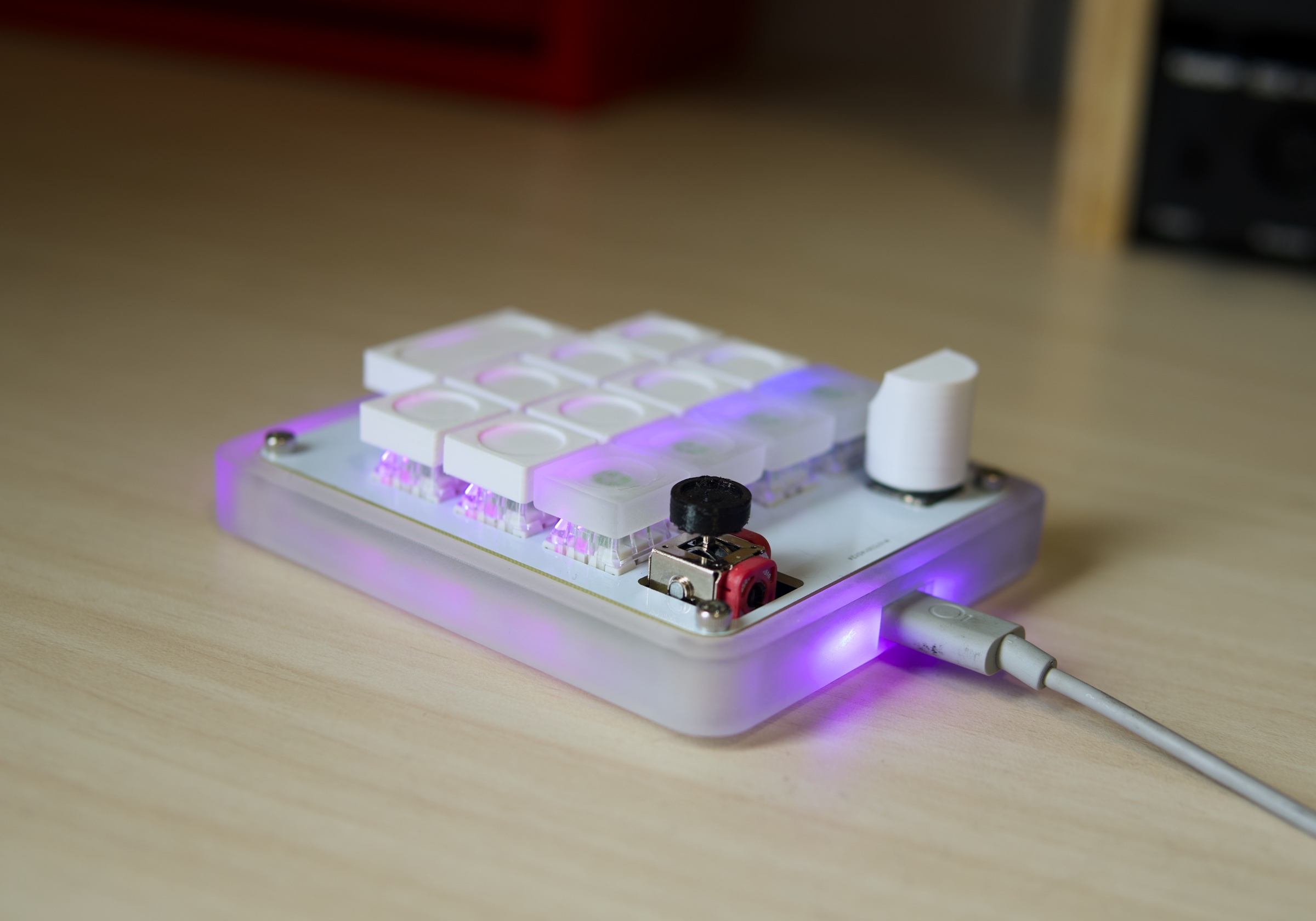 AgentPad13 powered on in its frosted case, with purple edge lighting.